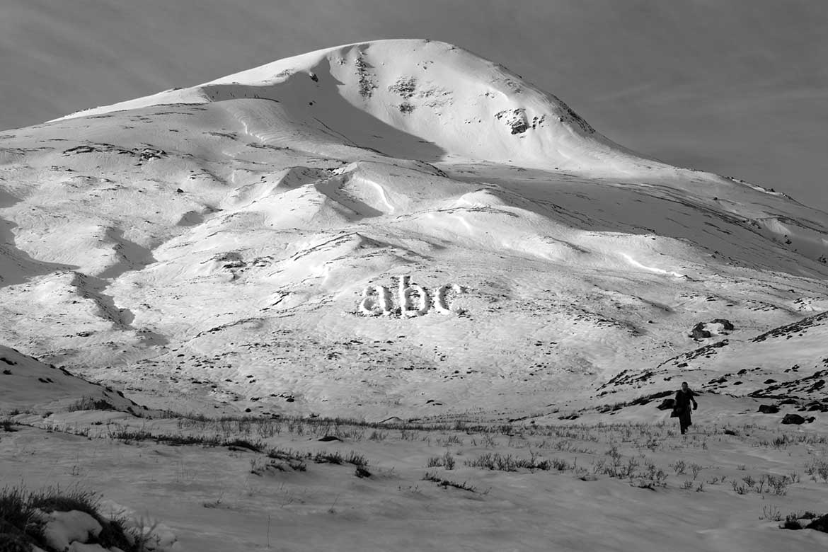 Melt by Michael Cross, the letters abc  made of snow piled up on a hillside in Scotland