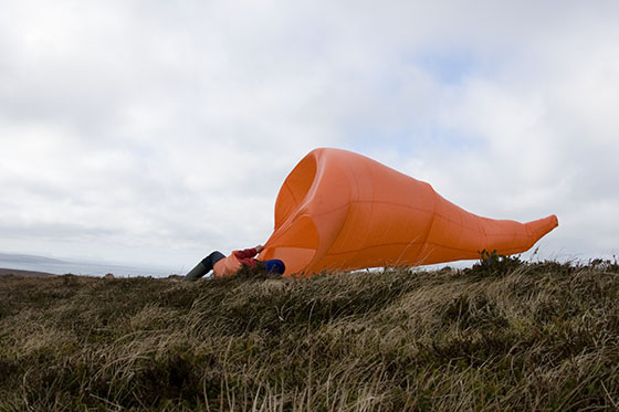 A smaller wind funnel in front of a Light House	